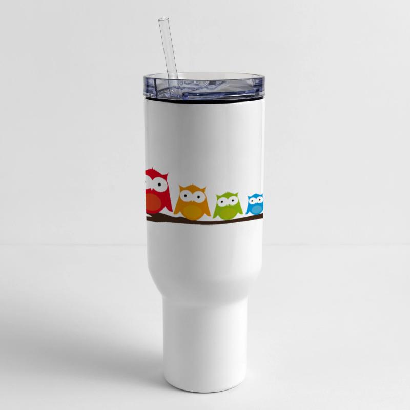 Colorful owl family sitting together on a branch